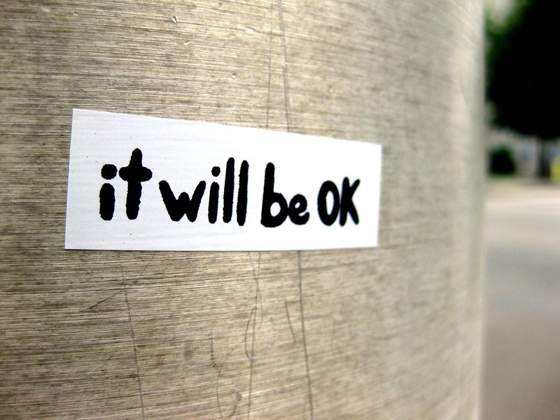 "it will be ok" sticker on telephone pole