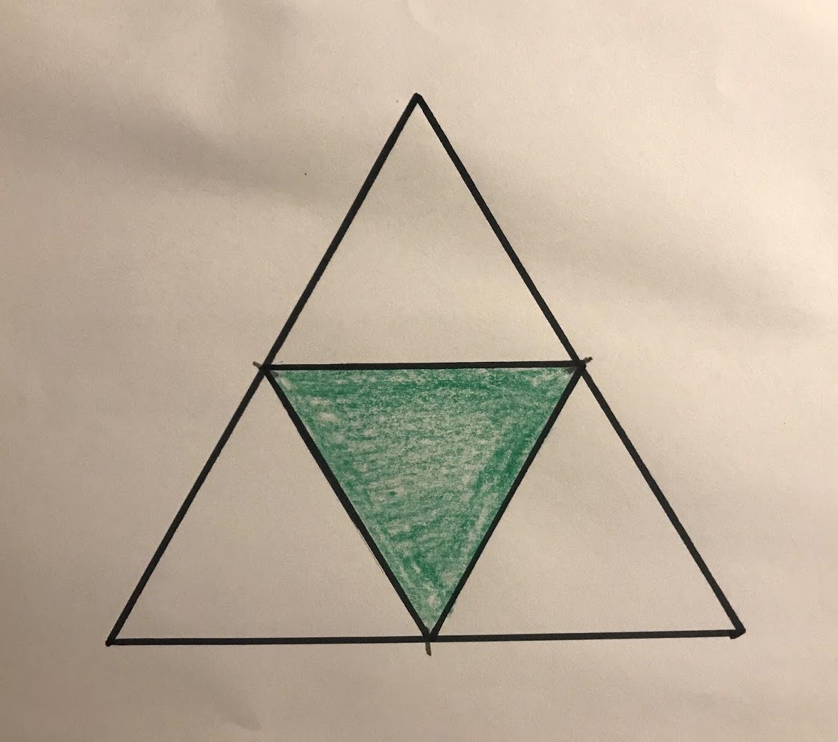 An equilateral triangle with a smaller, downward pointing green triangle contained inside.