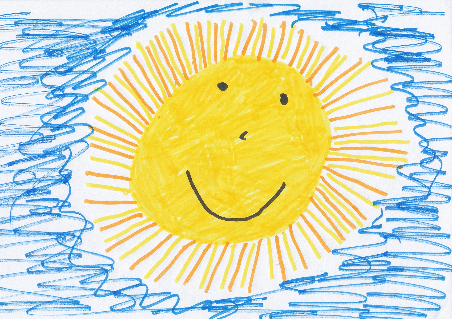 Drawing of a cartoon sun with a smiling face.