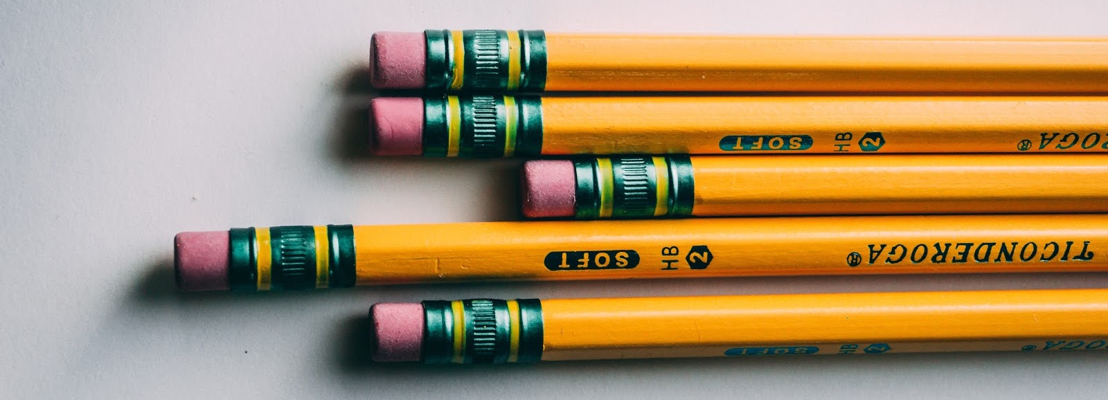 Pencils laying side-by-side.