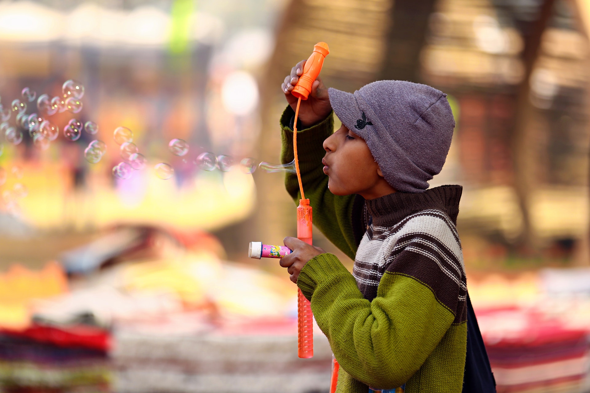 Child blowing bubbles. 