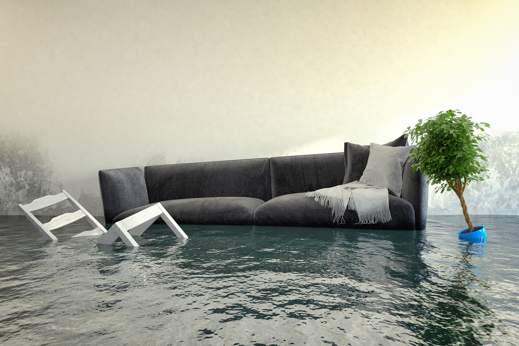 Couch floating in a living room full of water.